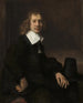 Un giovane uomo seduto a un tavolo, forse Govaert Flinck - Rembrandt van Rijn — vista dell’opera