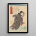 Donna in kimono nero a righe bianche che legge Chat giallo addormentato - Utagawa Kuniyoshi — quadro incorniciato alla parete