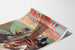 Manifesto Normandia vintage – Trouville, casino municipale, presentato su una pagina curva, visto in prospettiva.