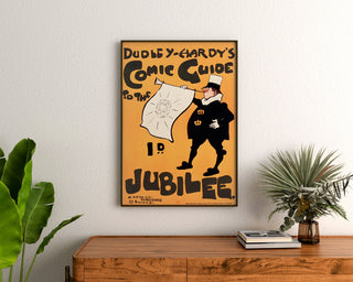 Manifesto vintage Dudley Hardy, comic guide, incorniciato sopra una cassettiera in legno, tra piante.