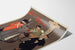 Manifesto vintage Shamus O’Brien, Opera Comique, presentato su una pagina curva, visto in prospettiva.