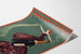 Manifesto vintage Woman and Wine, Princess’s Theatre, presentato su una pagina curva, visto in prospettiva.